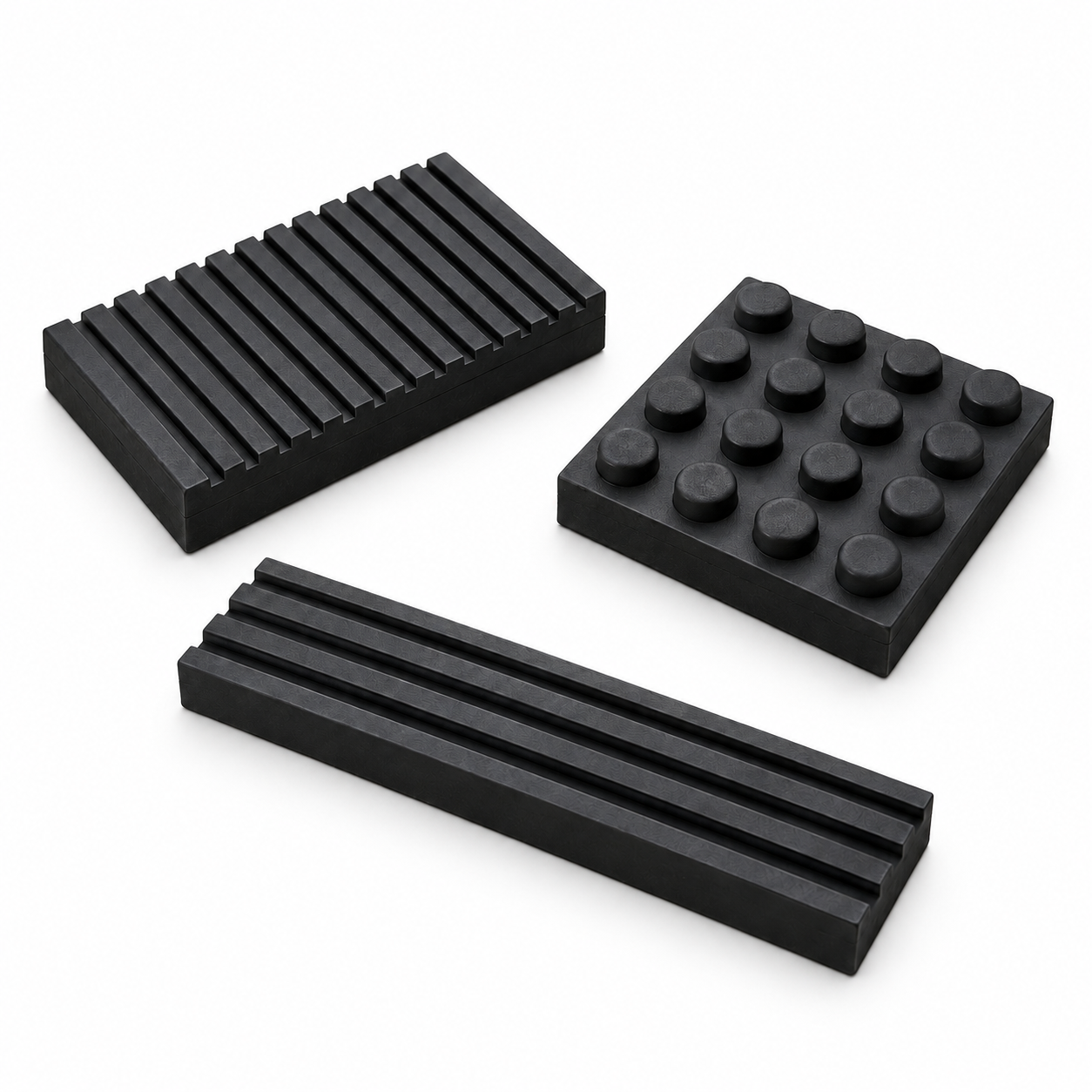Ribbed, raised-dot and grooved rubber vibration pads on a white background